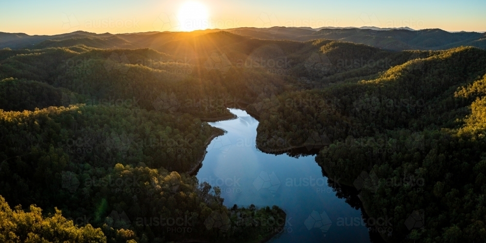 Aerial landscape of a lake surrounded by forest - Australian Stock Image