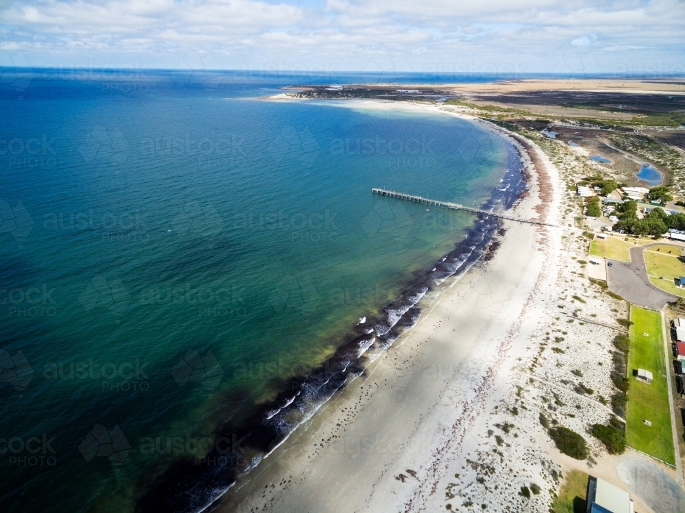 aerial of seaside shacks and beach - Australian Stock Image