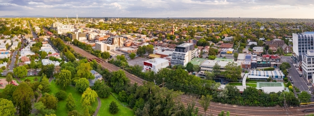 Aerial panorama of an inner city railway line between a park and buildings - Australian Stock Image