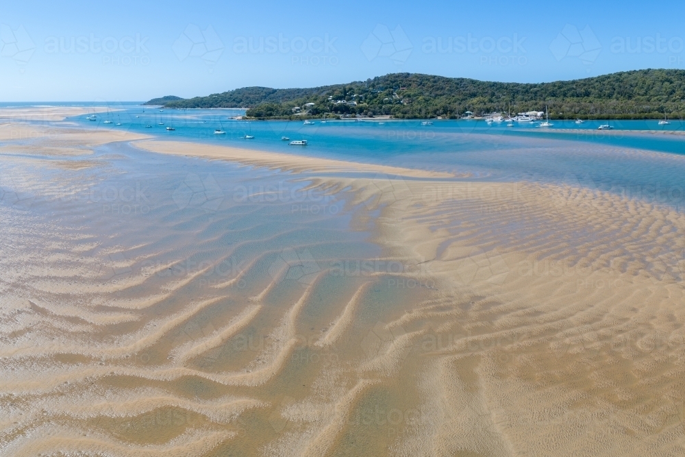 Aerial panorama of estuary, sandbars, and yachts at the Town of 1770, QLD. - Australian Stock Image