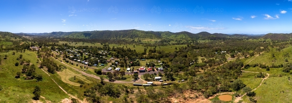 Aerial Panorama shot of rural area  with houses and mountains - Australian Stock Image