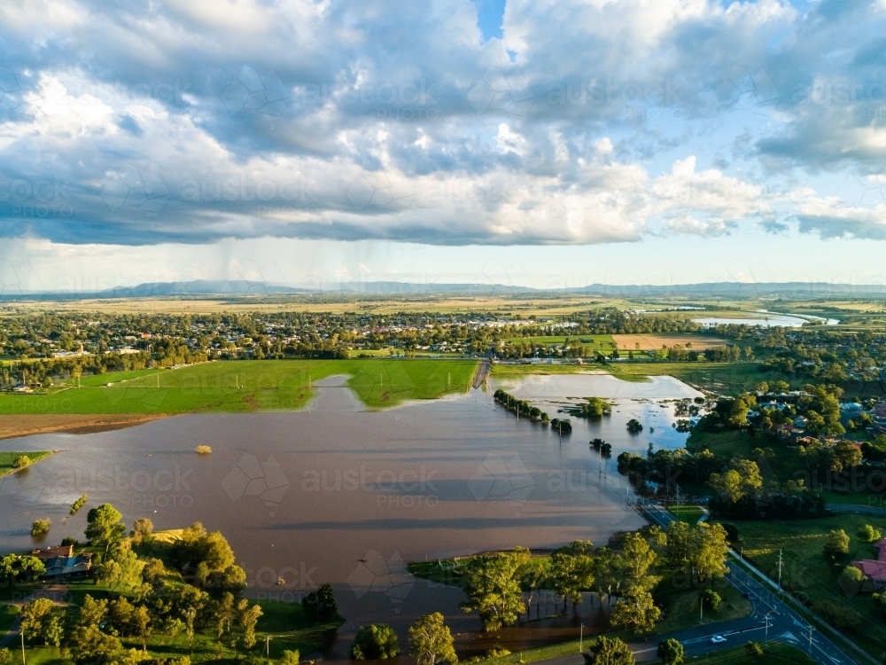 Aerial perspective of underwater road during flood in Singleton - Australian Stock Image