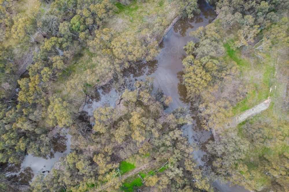 aerial shot of a river running through farmland - Australian Stock Image