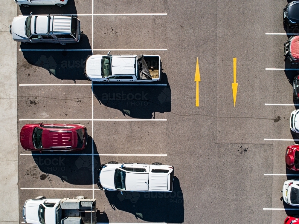 Aerial shot of cars parked in carpark with empty spaces - Australian Stock Image