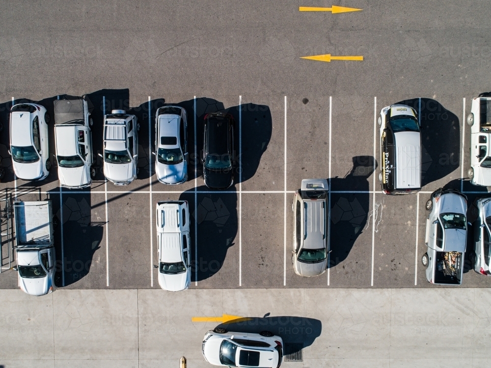 Aerial shot of cars parked in carpark with empty spaces - Australian Stock Image