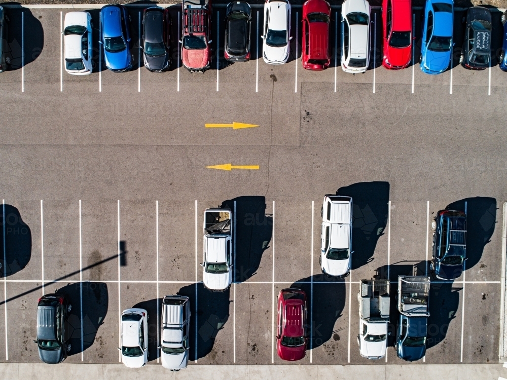 Aerial shot of cars parked in carpark with empty spaces - Australian Stock Image