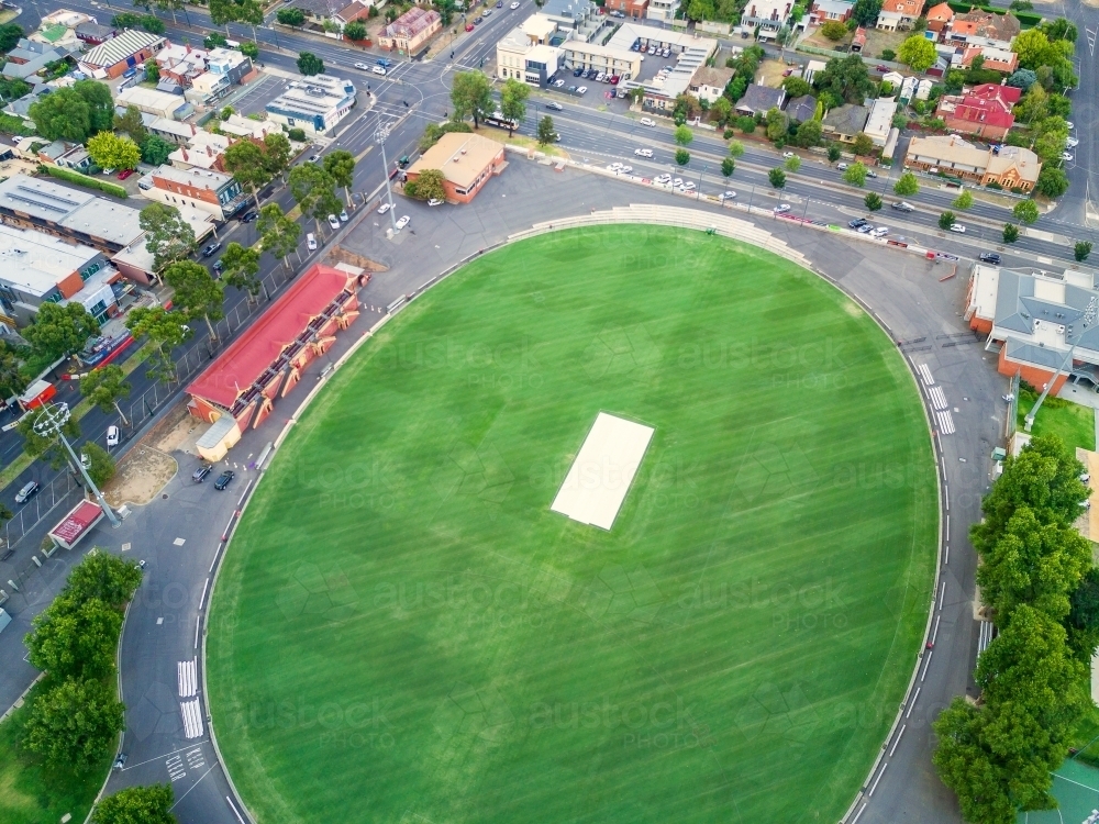 Aerial view a football oval and grandstand. - Australian Stock Image