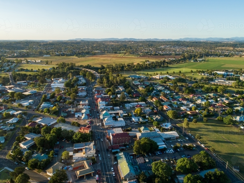 Aerial view down highway running through country town of Singleton - Australian Stock Image