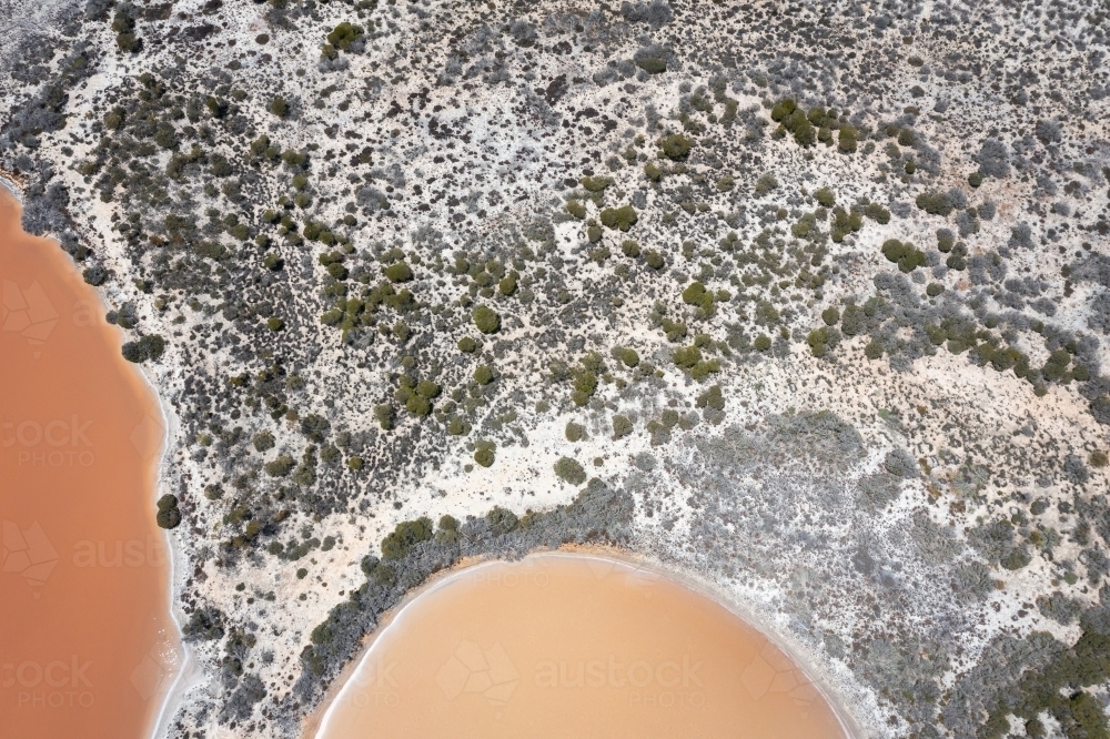 aerial view looking down on two salt lakes and the land in between - Australian Stock Image