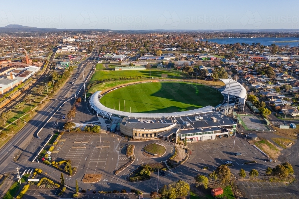 Aerial view of a AFL football stadium with surrounding vacant car park - Australian Stock Image