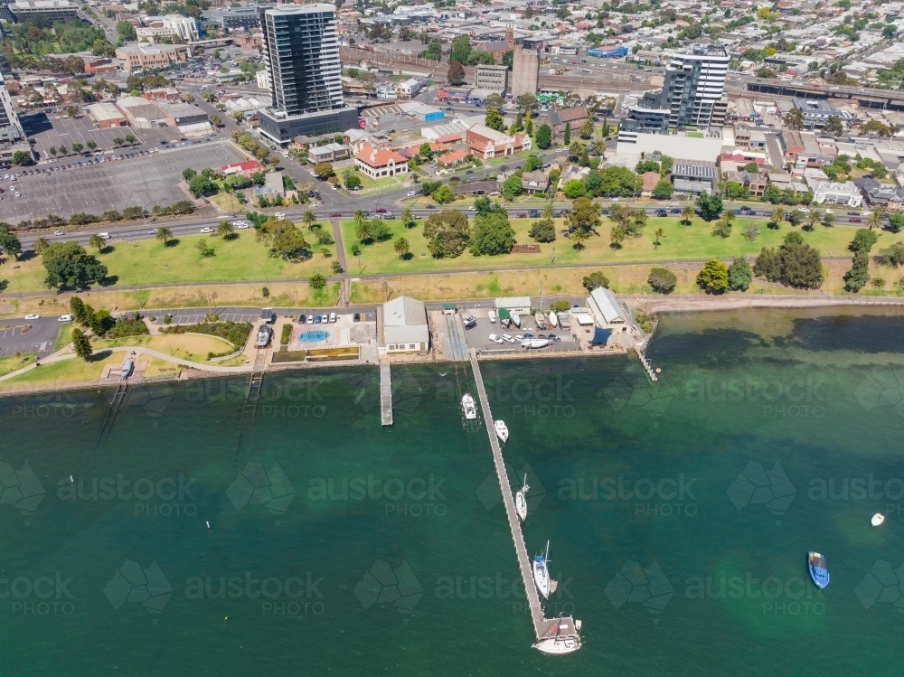 Image of Aerial view of a bay side city waterfront with a long narrow ...