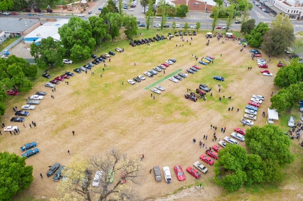 Aerial view of a car rally parked around a cricket oval - Australian Stock Image