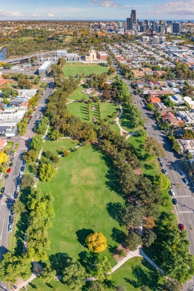 Aerial view of a city park with walking tracks and tree lines - Australian Stock Image