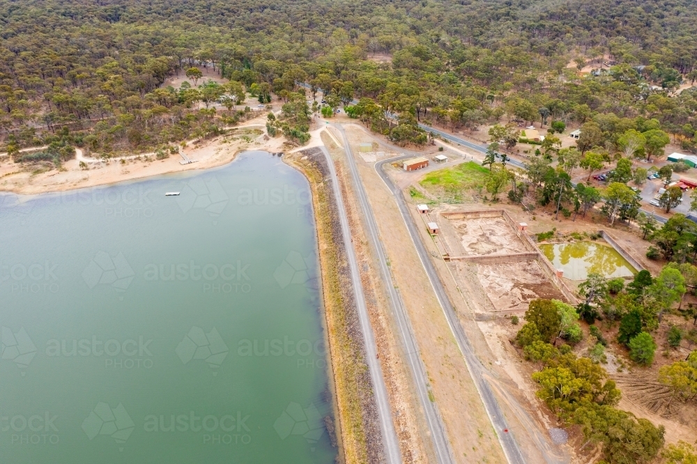 Aerial view of a dam wall and settling ponds - Australian Stock Image