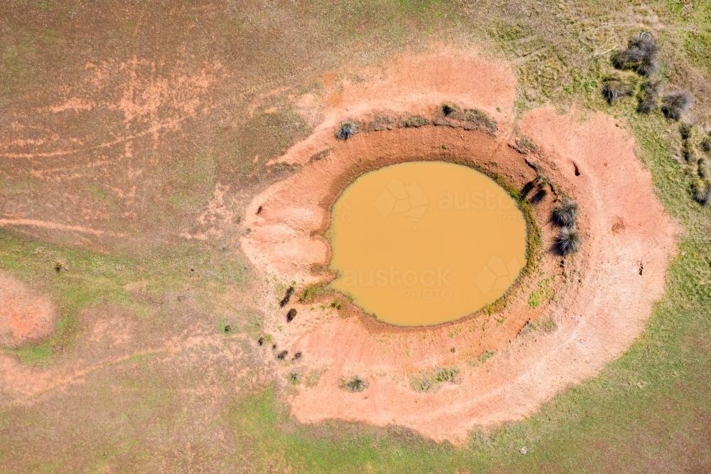 Aerial view of a farm dam with dried edges - Australian Stock Image