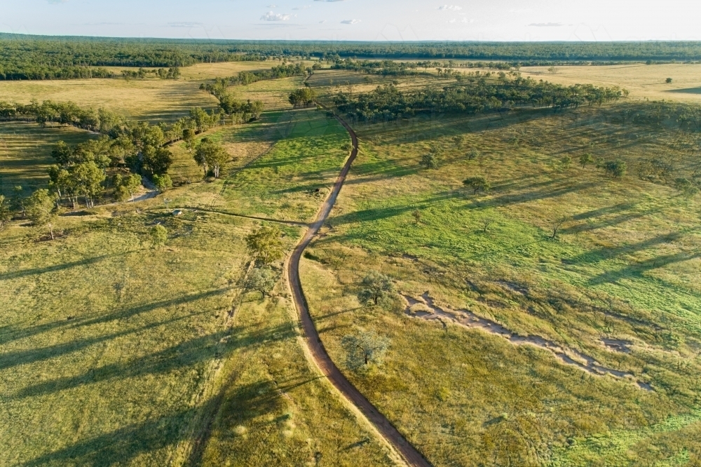 Aerial view of a farm road on a cattle property. - Australian Stock Image