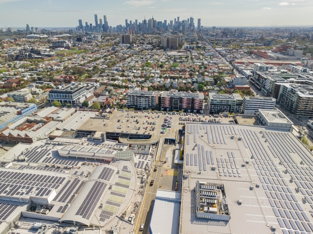 Aerial view of a large inner city shopping centre with skyscrapers in the distance - Australian Stock Image