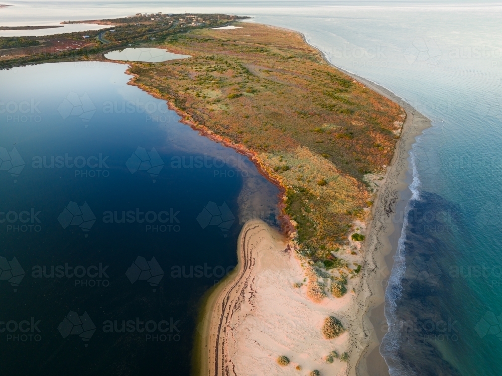 Aerial view of a narrow strip of land running out to sea with ocean on either side - Australian Stock Image