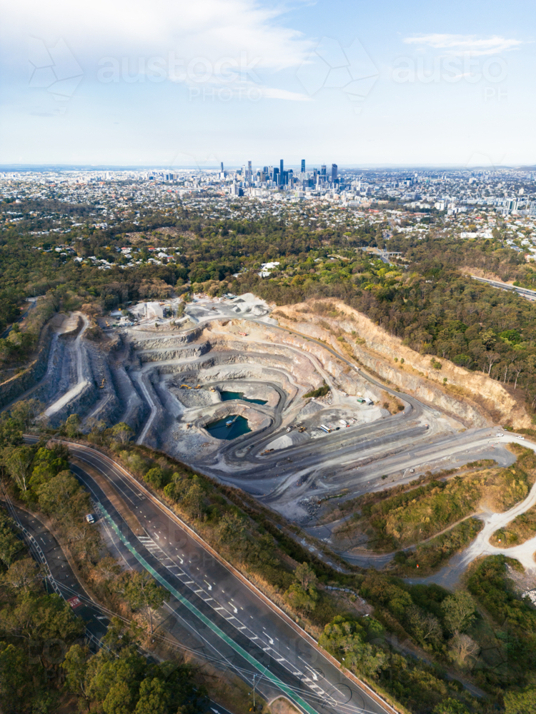 Aerial view of a quarry at Mount Coot-tha in close proximity to the city - Australian Stock Image