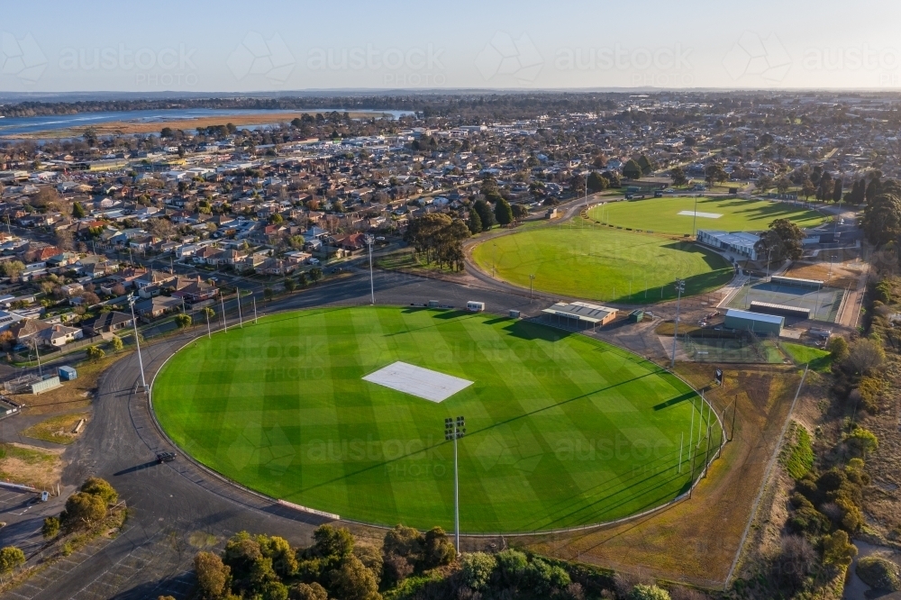 Aerial view of a series of AFL football ovals amongst suburban housing - Australian Stock Image