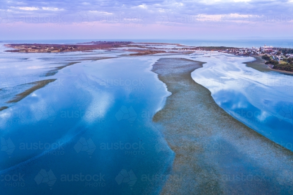 Aerial view of a shallow bay with tidal currents and marshy islands - Australian Stock Image