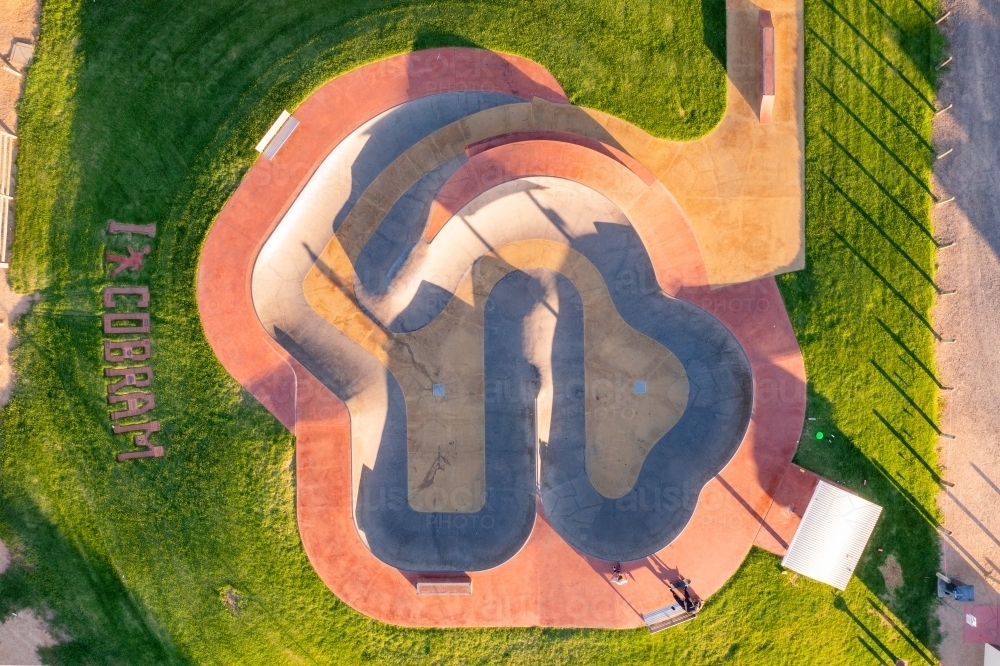 Aerial view of a skate bowl  surrounded by a grassy area - Australian Stock Image