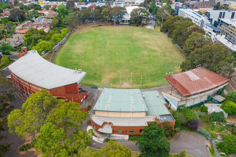 Aerial view of a suburban football oval and grandstands - Australian Stock Image