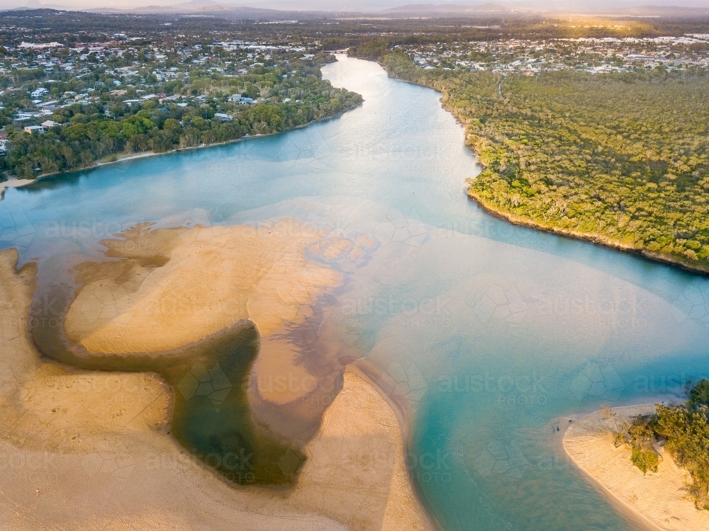 Aerial view of a widening river with sandbars - Australian Stock Image