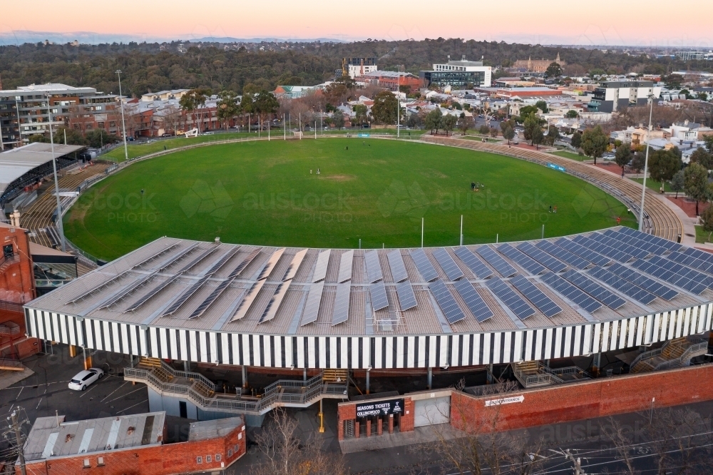 Aerial view of an AFL football stadium amongst suburban housing - Australian Stock Image