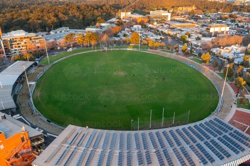 Aerial view of an AFL football stadium amongst suburban housing - Australian Stock Image