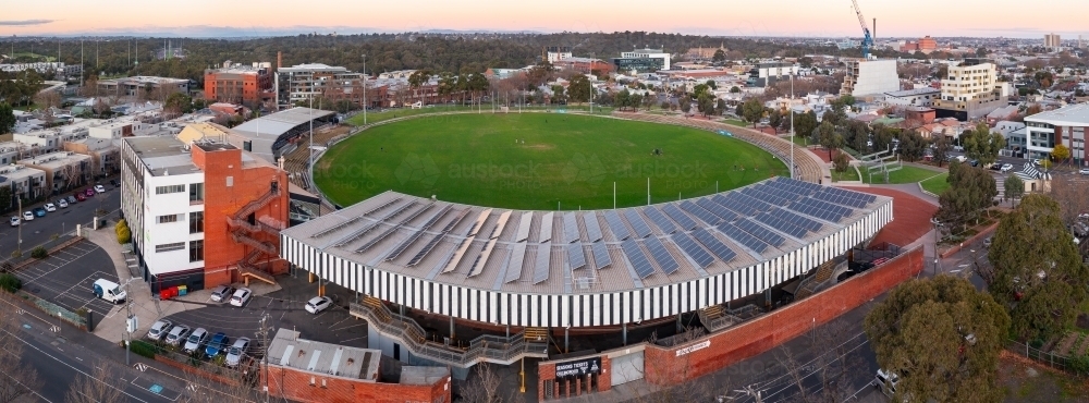 Aerial view of an AFL football stadium amongst suburban housing - Australian Stock Image