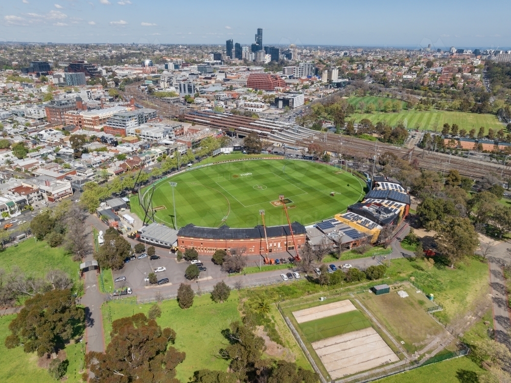 Aerial view of an inner city sports oval surrounded by parkland and residential housing - Australian Stock Image