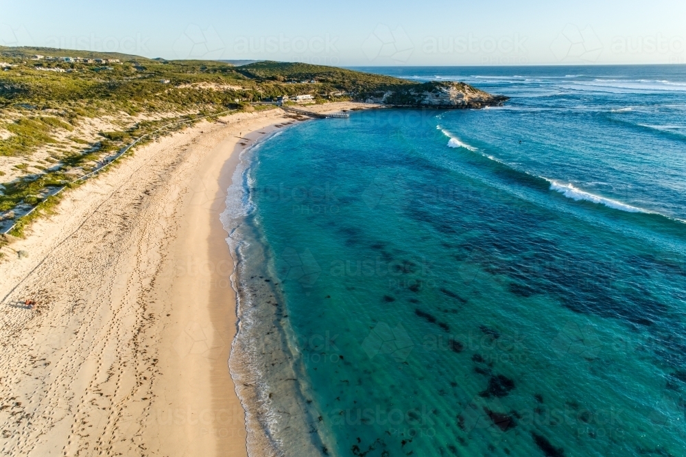 Aerial view of beach, headland, and ocean - Australian Stock Image