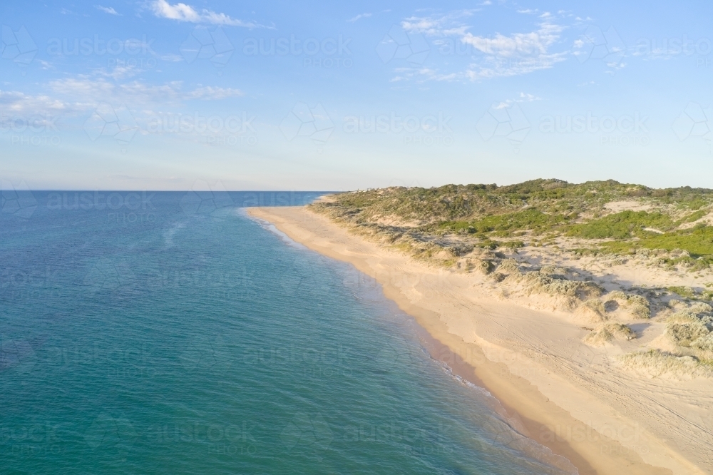 Aerial view of beach near Mandurah, Western Australia in the late afternoon in Summer - Australian Stock Image