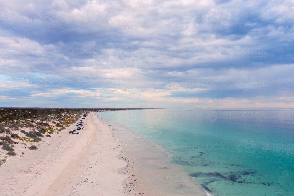 aerial view of beach with moody clouds - Australian Stock Image