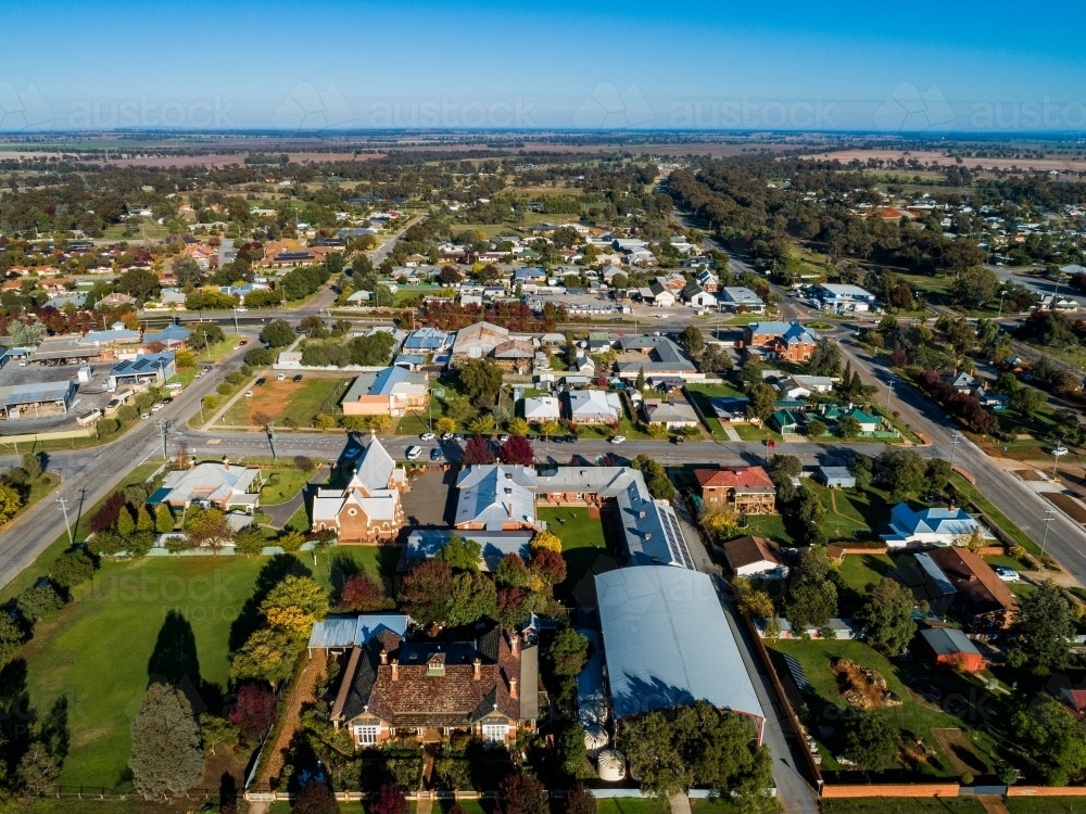 Aerial view of bright morning sunlight shining on rooves of houses in Riverina area country town - Australian Stock Image