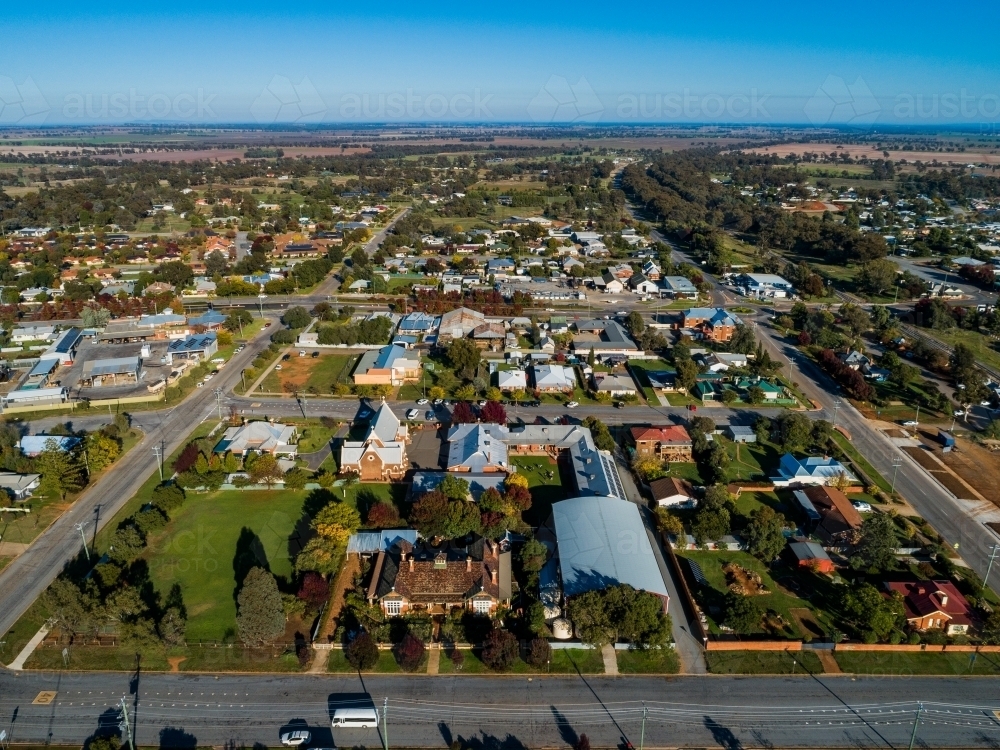 Aerial view of bright morning sunlight shining on rooves of houses in Riverina area country town - Australian Stock Image