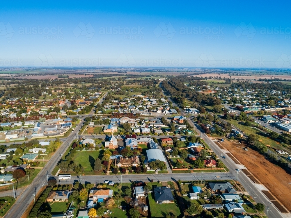 Aerial view of bright morning sunlight shining on rooves of houses in Riverina area country town - Australian Stock Image