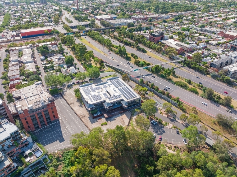 Aerial view of city buildings and and bridges on both side of a major freeway - Australian Stock Image