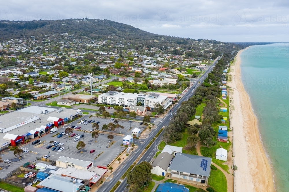 Aerial view of coastal highway and shopping mall near the beach - Australian Stock Image