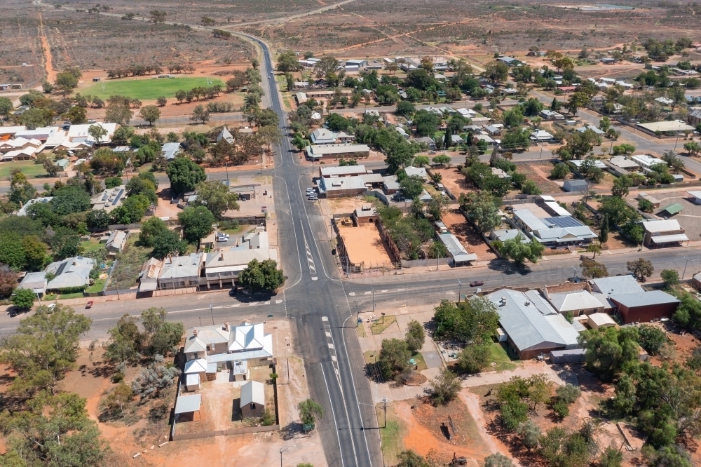 Image of Aerial view of crossroads in a remote outback town - Austockphoto