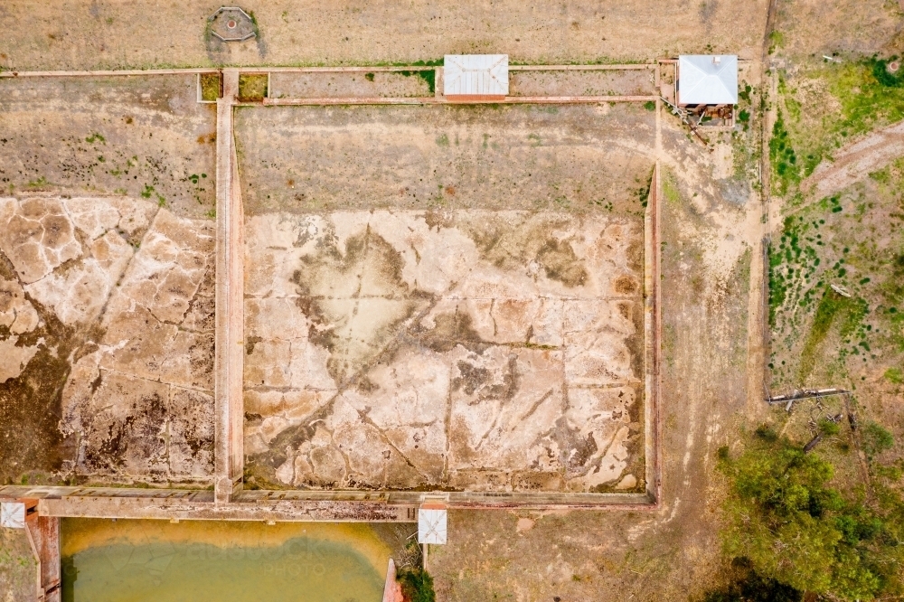 Aerial view of disused settling ponds with muddy bottoms - Australian Stock Image