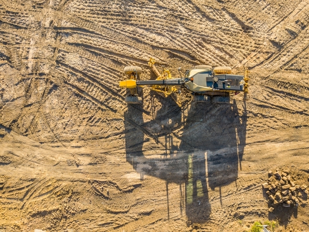 Aerial view of earthmoving machinery on a construction site - Australian Stock Image