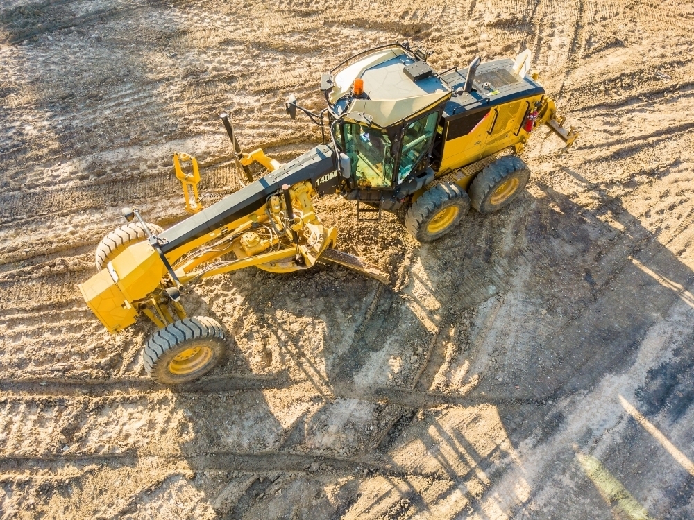 Aerial view of earthmoving machinery on a construction site - Australian Stock Image