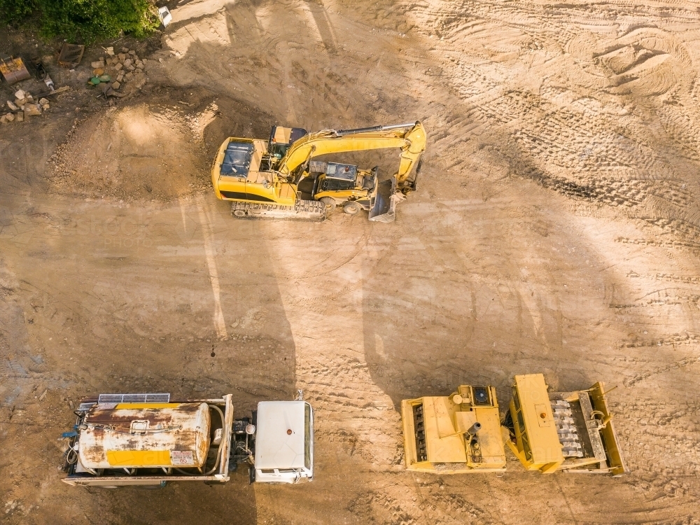 Aerial view of earthmoving machinery on a construction site - Australian Stock Image