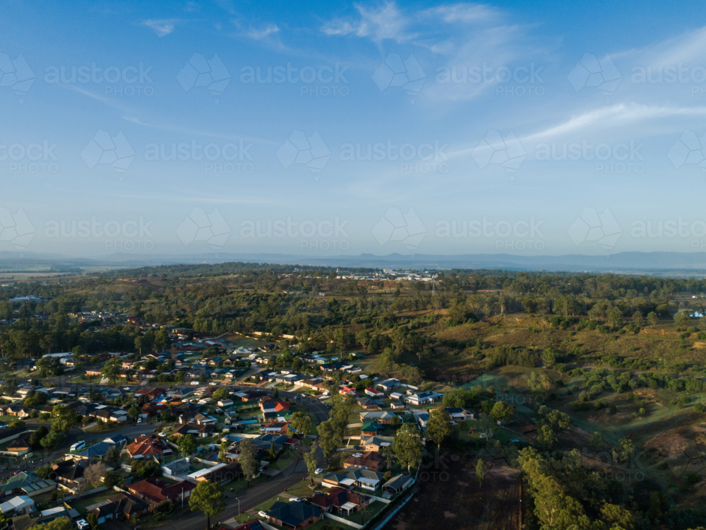 Aerial view of edge of town where bush meets developed land in Singleton - Australian Stock Image