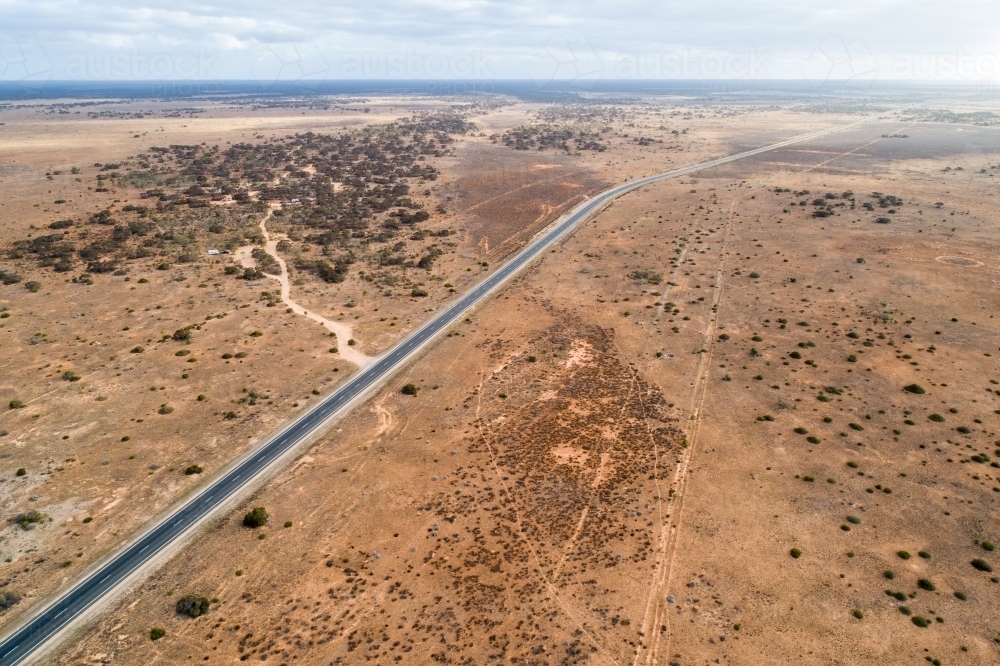 Aerial view of Eyre Highway and Nullarbor Plain near Cocklebiddy, Western Australia. - Australian Stock Image