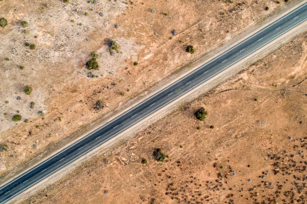 Aerial view of Eyre Highway and Nullarbor Plain near Cocklebiddy, Western Australia. - Australian Stock Image