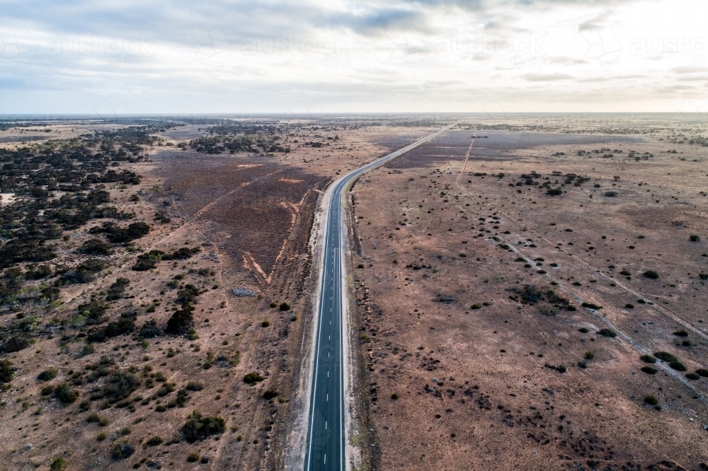 Aerial view of Eyre Highway and Nullarbor Plain near Cocklebiddy, Western Australia. - Australian Stock Image