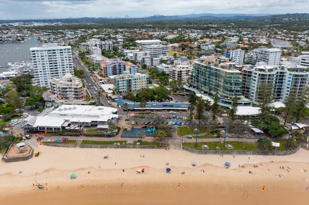 Image of Aerial view of high rise real estate behind a surf life saving ...